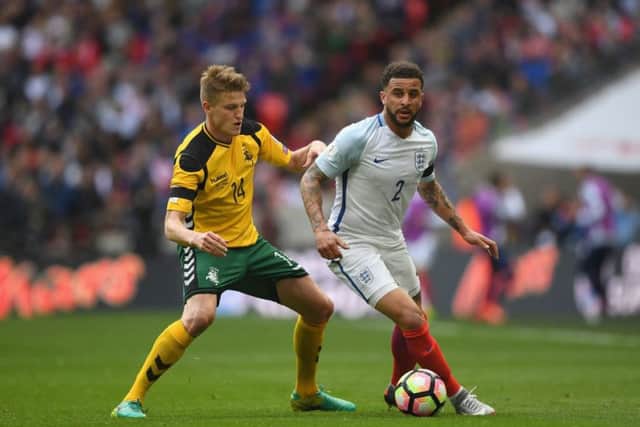 Vykintas Slivka attempts to dispossess Kyle Walker during a match between Lithuania and England at Wembley. Picture: Getty