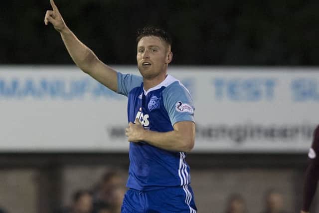 Peterhead striker Rory McAllister celebrates his late penalty winner. Picture: SNS