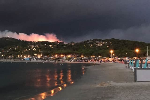 A picture taken at sunrise on July 26, 2017 shows a fire burning the forest by the beach in Bormes-les-Mimosas, southern France.
 Picture: Marion Leflour/AFP/Getty Images