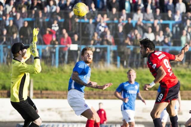 Sofien Moussa heads Dundees third goal against Cowdenbeath to complete his hat-trick. Picture: SNS.