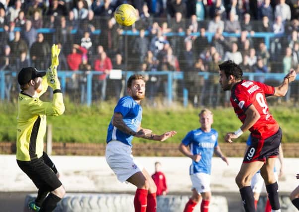 Sofien Moussa heads Dundees third goal against Cowdenbeath to complete his hat-trick. Picture: SNS.