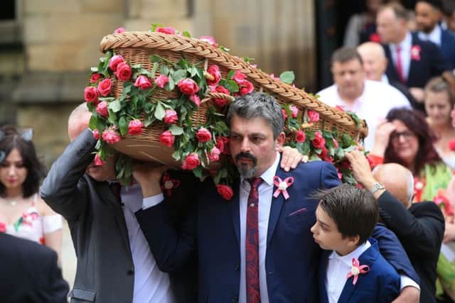 Dad Andrew Roussos and brother Xander hold the coffin of Saffie Rousso. Picture: Danny Lawson/PA Wire