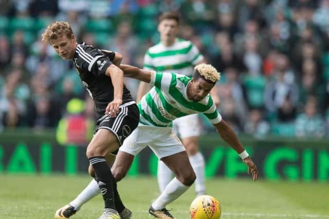 Scott Sinclair of Celtic pushes off Vegar Eggen Hedenstad. Picture: Steve Welsh/Getty Images