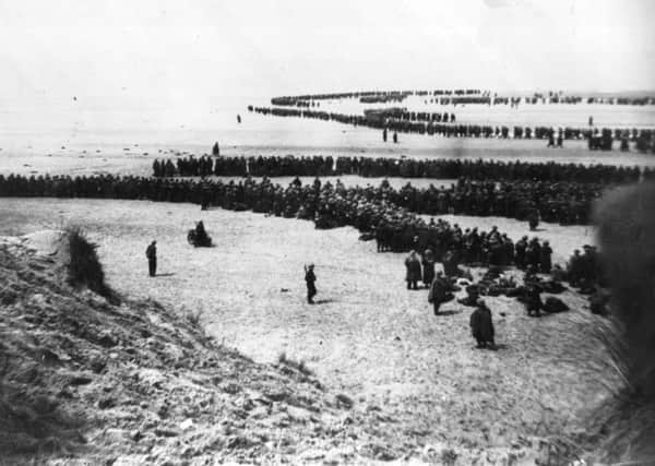 Defeated British and French troops waiting on the dunes at Dunkirk to be picked up by ships and taken to England. Picture: Topical Press Agency/Getty Images