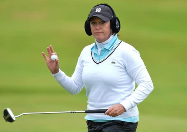American Cristie Kerr wore snazzy ear muffs to combat the cold and wind at Dundonald Links. Picture: Mark Runnacles/Getty