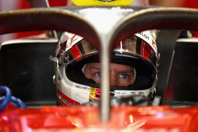 Sebastian Vettel sits in his Ferrari fitted with the cockpit safety device known as the halo. Picture: Getty.