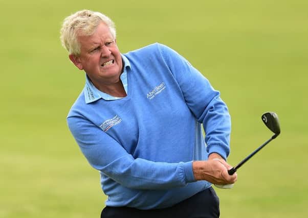 Colin Montgomerie hits an approach shot during the first round of the Senior Open Championship at Royal Porthcawl. Picture: Getty