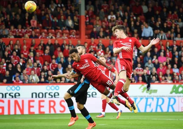 Aberdeen midfielder Ryan Christie rises to steer a header into the Apollon Limassol net. Picture: SNS.