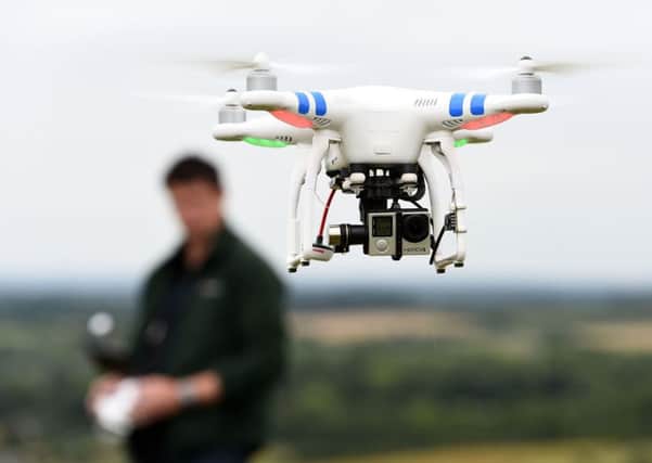 File photo dated 11/08/15 of a drone in flight, as drones have been banned from large parts of London and surrounding areas during Barack Obama's visit. PRESS ASSOCIATION Photo. Issue date: Tuesday April 19, 2016. The US President and his wife Michelle arrive on Thursday night, just days after an unmanned aircraft is believed to have collided with a British Airways flight landing at Heathrow. See PA story AIR Drones. Photo credit should read: Andrew Matthews/PA Wire