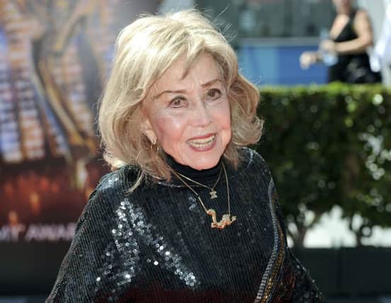In this Sept. 15, 2013 file photo, June Foray arrives at the Primetime Creative Arts Emmy Awards at the then Nokia Theatre L.A. Live, in Los Angeles. Foray's niece, Robin Thaler, said Thursday, July 27, 2017, that Foray died at Wednesday in a Los Angeles hospital of cardiac arrest. She was 99. (Photo by Richard Shotwell/Invision/AP, File)