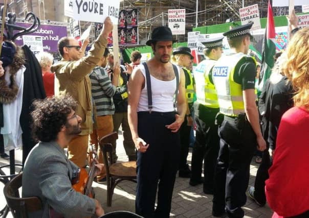 Incubator performers mime their production as a reponse to being silenced by protests in Edinburgh in 2014