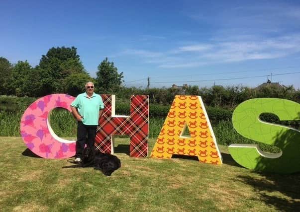 CHAS Director of Development and Communications, Iain McAndrew and his guide dog, Gino.