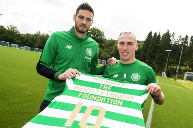 Craig Gordon and Scott Brown mark the announcement of Celtic FC Foundation's Â£10,000 donation to the Bradley Lowery Foundation. Picture: SNS