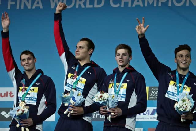 Stephen Milne, Nicholas Grainger, Duncan Scott and Britain's James Guy celebrate on the podium. Picture: Getty Images