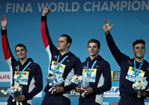 Stephen Milne, Nicholas Grainger, Duncan Scott and Britain's James Guy celebrate on the podium. Picture: Getty Images