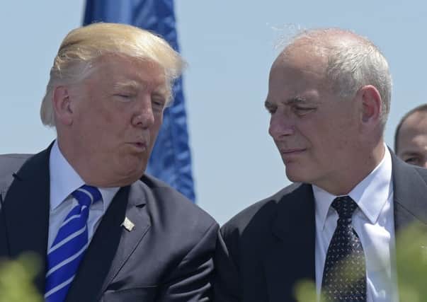 President Donald Trump talks with his now Chief of Staff John Kelly (AP Photo/Susan Walsh)