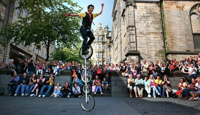 Street entertainers perform on the Royal Mile. Picture: Jeff J Mitchell/Getty Images