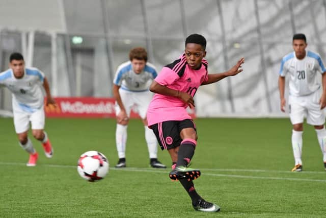 Karamoko Dembele slots home a penalty to make it 2-0 to Scotland. Picture: SNS/Paul Devlin