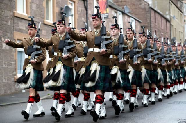 Soldiers from The Royal Regiment of Scotland Black Watch (3 SCOTS) march during a parade and service in Crieff, Perthshire, to mark the 100-year commemoration of the Battle of Passchendaele. PRESS ASSOCIATION Photo. Picture date: Sunday July 30, 2017. Photo credit should read: Jane Barlow/PA Wire
