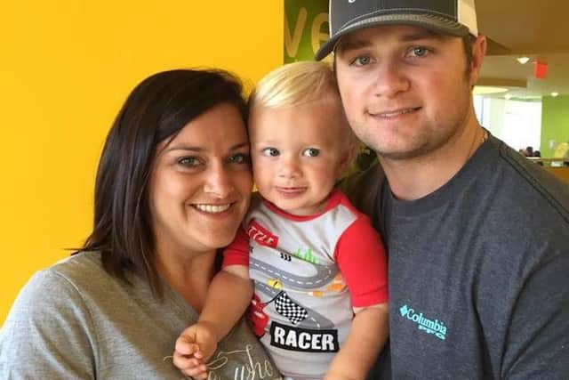 Kanon Newsome who was born deaf pictured with parents Lindsey and Justin. Picture: SWNS