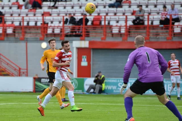 Steven Boyd heads home Hamilton's third goal against Stenhousemuir. Picture: SNS