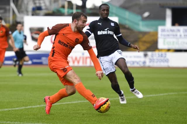 Dundee Uniteds Paul McMullan strikes to put the Tannadice side ahead against rivals Dundee Picture: SNS.