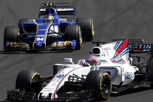 Scotlands Paul Di Resta takes a bend followed by Pascal Wehrlein. Picture: AP.