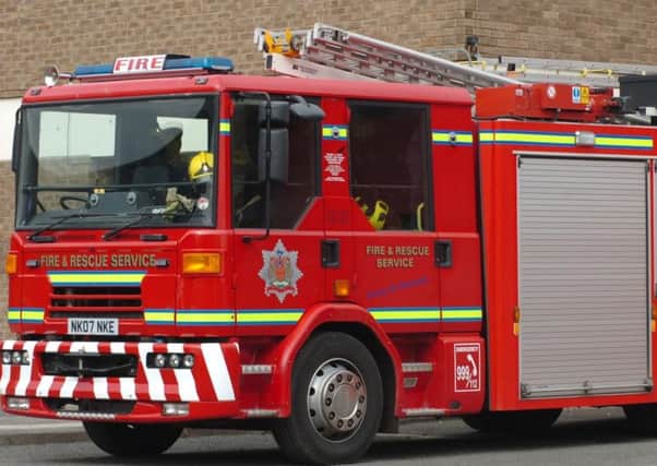 An Annan woman was rescued by firefighters but died at the scene.