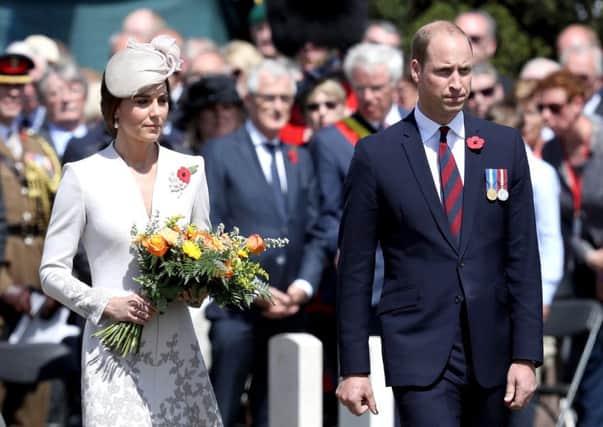 Catherine, Duchess of Cambridge with flowers and Prince William, Duke of Cambridge during a ceremony at the Commonwealth War Graves Commisions's Tyne Cot Cemetery. Picture: Chris Jackson/Getty Images