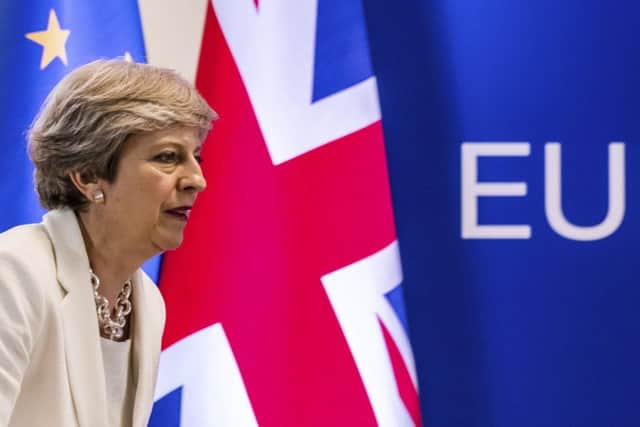 Theresa May prepares to address a media conference at an EU summit in Brussels. Picture: AP Photo/Geert Vanden Wijngaert
