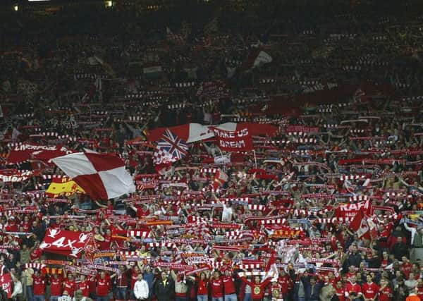 85 per cent of fans old enough to have stood on the Kop terracing want a standing section. Picture: Getty.