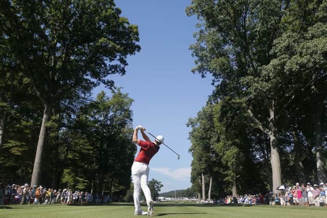 Rory McIlroy watches his tee shot on the fifth hole at the 2016 US PGA Championship at Baltusro. Picture: Tony Gutierrez/AP