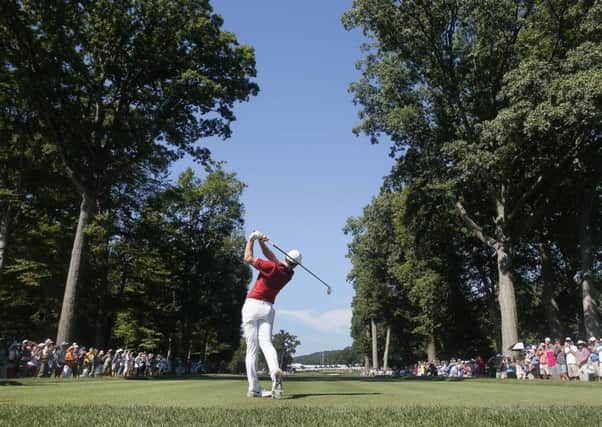 Rory McIlroy watches his tee shot on the fifth hole at the 2016 US PGA Championship at Baltusro. Picture: Tony Gutierrez/AP
