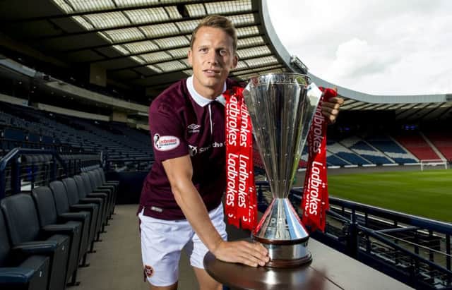 Christophe Berra with the Ladbrokes Premiership trophy. Picture: SNS