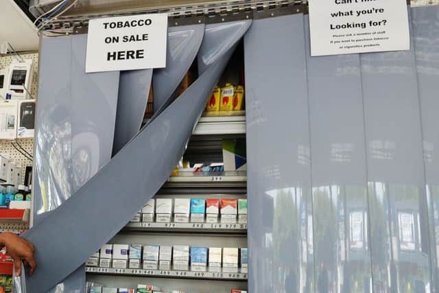 Tobacco firms are enticing Scottish retailers to promote their products despite ban, a new study has found. Picture: John Stillwell/PA Wire