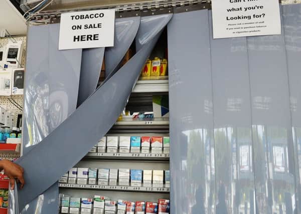 Tobacco firms are enticing Scottish retailers to promote their products despite ban, a new study has found. Picture: John Stillwell/PA Wire