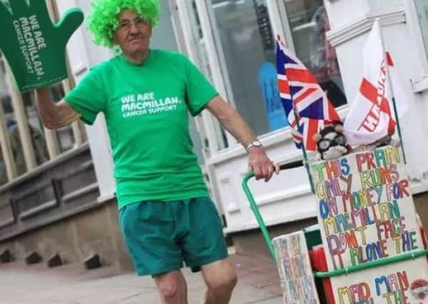 John Buckhill is known as the 'Mad man with a pram' collects donations for Macmillan.