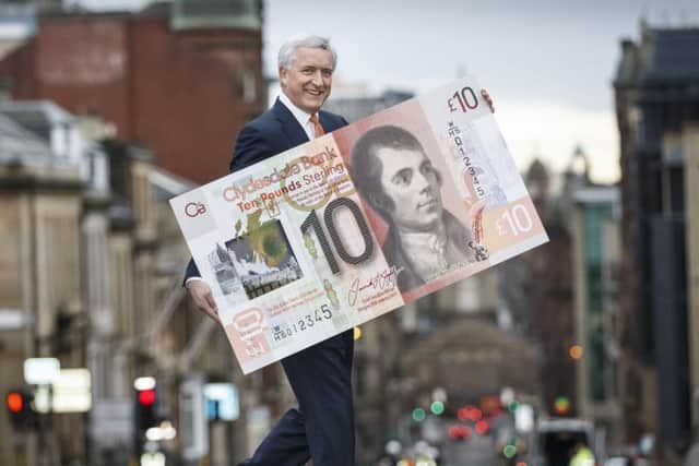 Chief executive David Duffy with a new-style Clydesdale banknote. Picture: Robert Perry