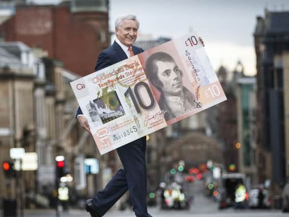 Chief executive David Duffy with a new-style Clydesdale banknote. Picture: Robert Perry