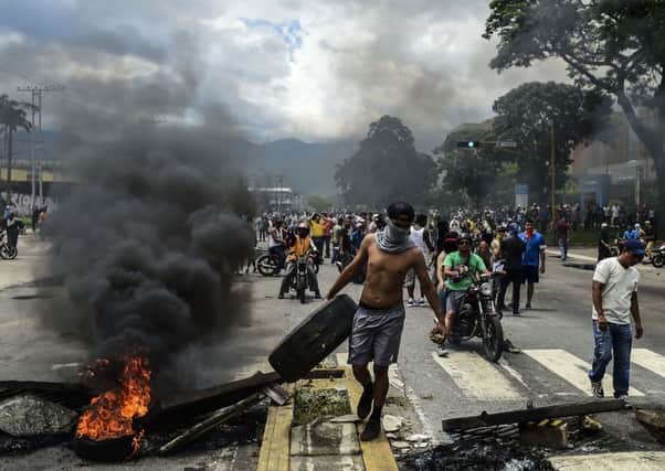 Anti-government activists build a barricade in Venezuela's third city, Valencia. Picture: AFP