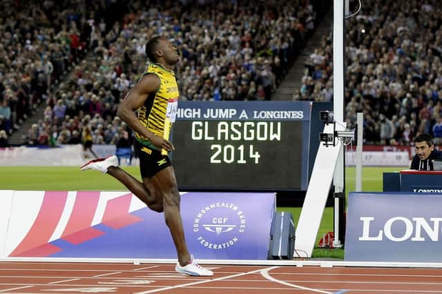 Usain Bolt completes the anchor leg of the Mens 4x100m Relay at the 2014 Commonwealth Games in Glasgow. Picture: Michael Gillen/JP