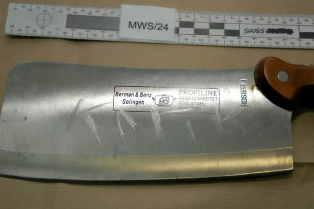 A meat cleaver which had the word KAFIR (meaning non-believer) scratched onto the blade.  . Picture: West Midlands Police