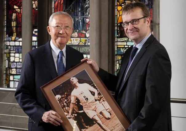 Dr HK Cheng, left, with CEO of the Eric Liddell Centre, John MacMillan. Picture: Contributed