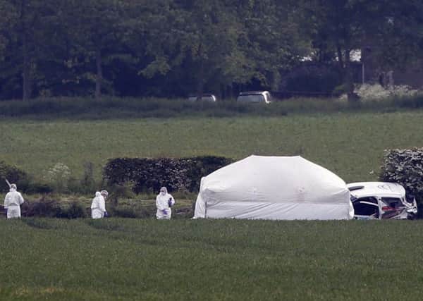 Forensic officers at the scene in Little Swinton, near Coldstream, where three people were killed after a car lost control during the Jim Clark Rally. Picture; PA