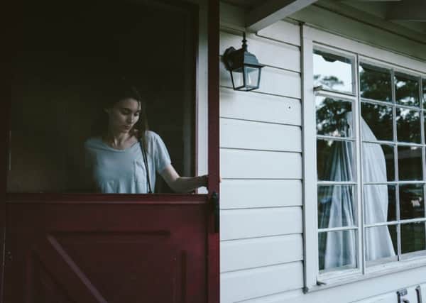 Rooney Mara and Casey Affleck (under a sheet) in A Ghost Story. Picture: Bret Curry