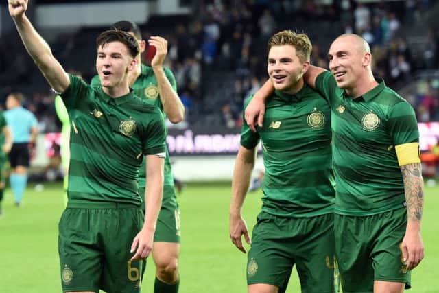 Celtic's Kieran Tierney, James Forrest and Scott Brown celebrate at full time in Trondheim. Picture: SNS.