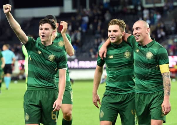 Celtic's Kieran Tierney, James Forrest and Scott Brown celebrate at full time in Trondheim. Picture: SNS.