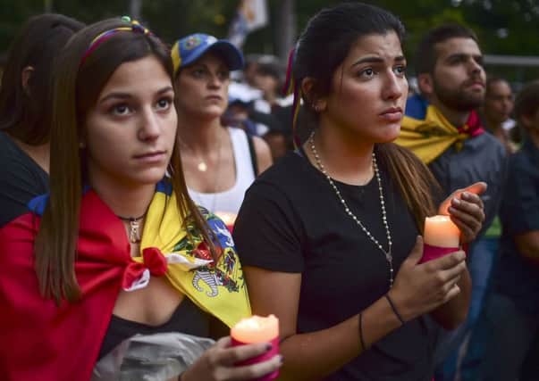 Venezuelans protest against President Nicolas Maduro, in Caracas. Picture: RONALDO SCHEMIDT/AFP/Getty Images