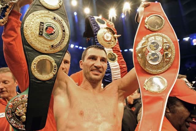Wladimir Klitschko with his belts after beating David Haye. Picture: AP.