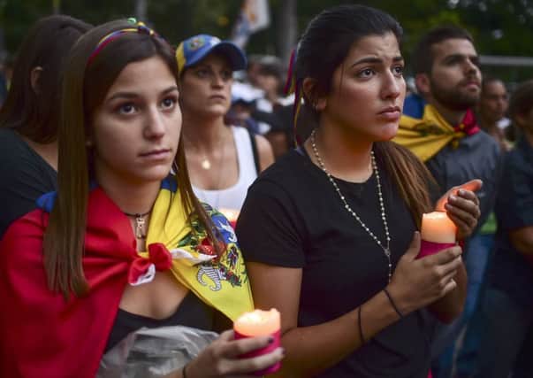 Venezuelans protest against President Nicolas Maduro in Caracas. Picture: AFP/Getty Images
